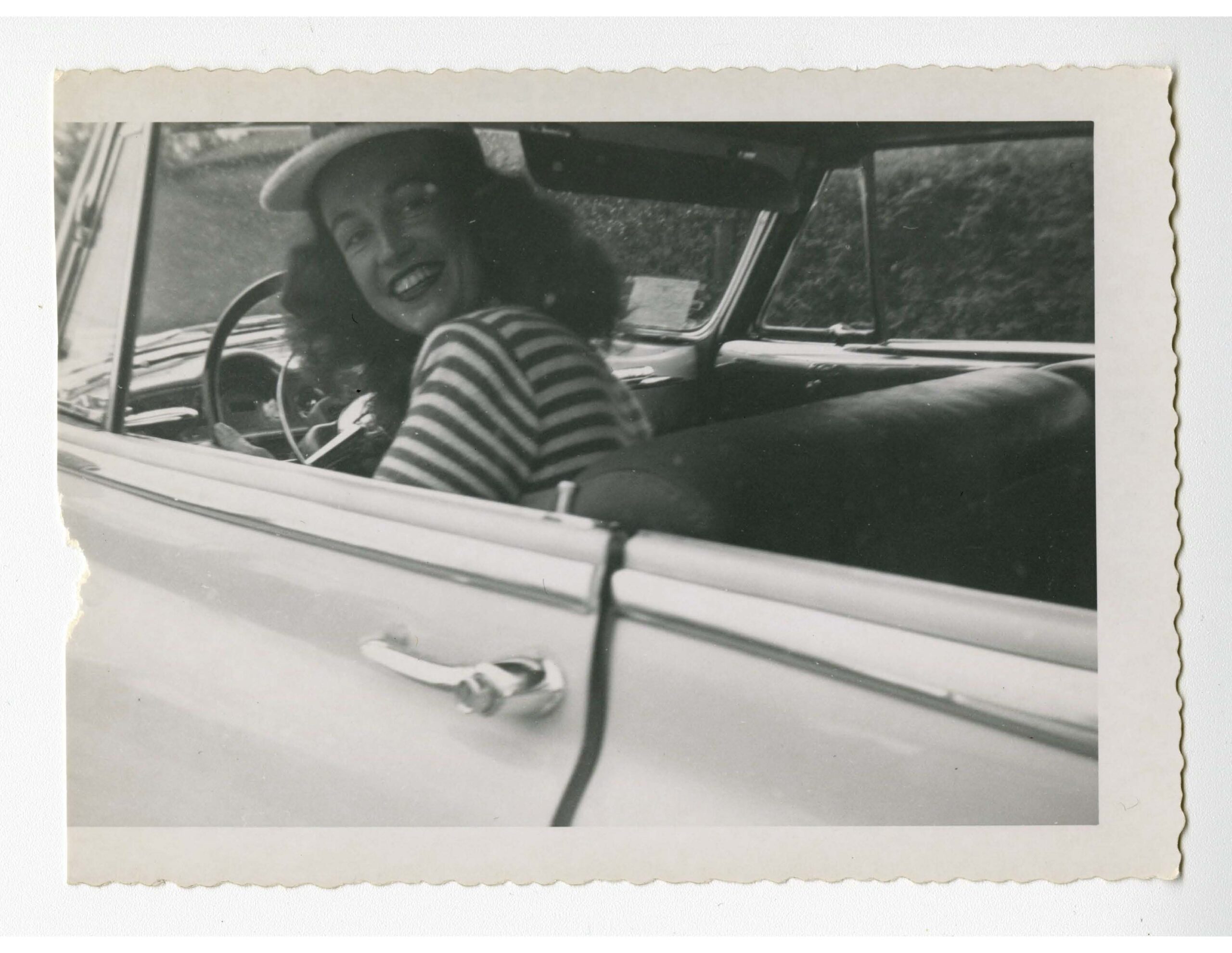 Lisa Ben smiling out a car window.